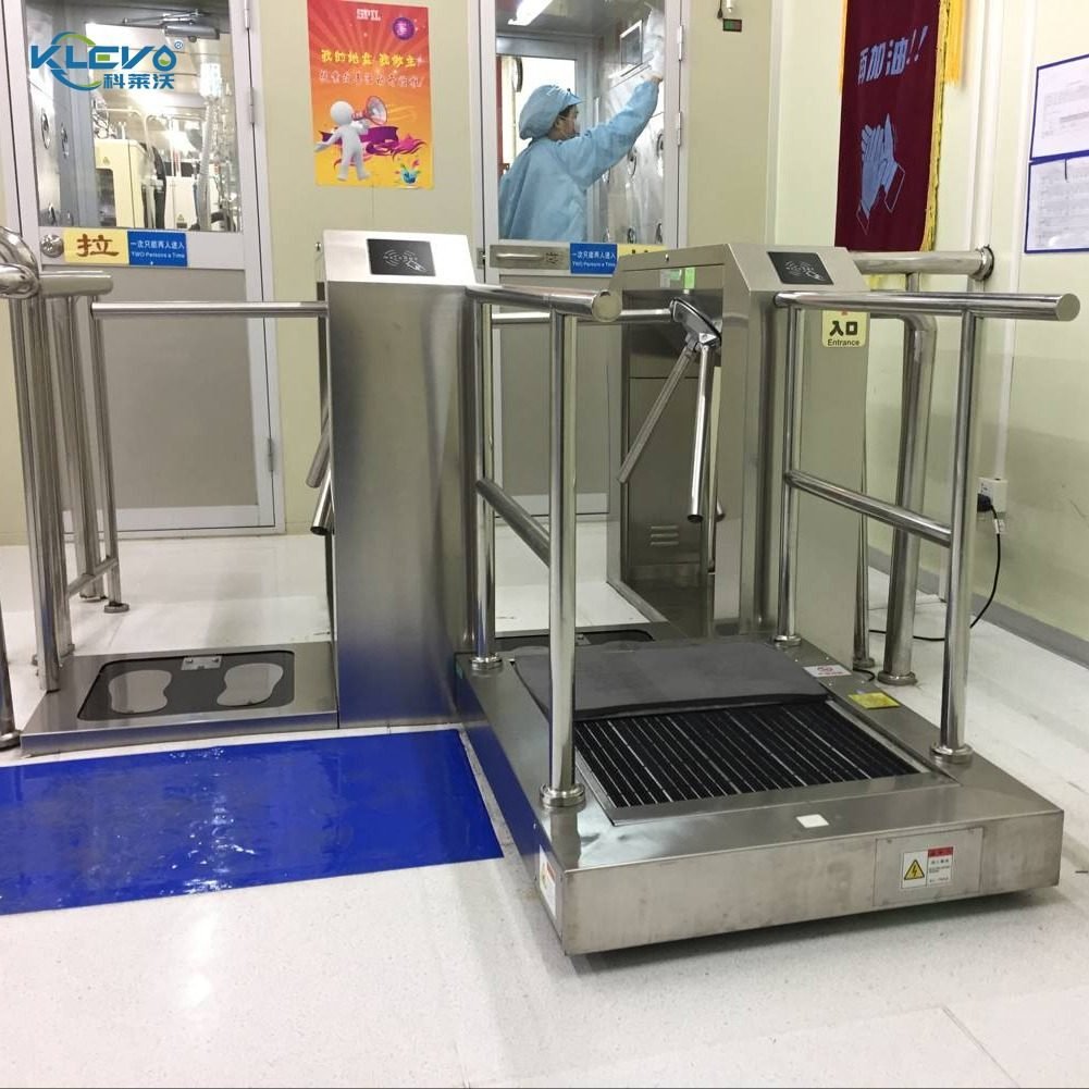 Sole cleaner paired with turnstile access control at a plant entrance